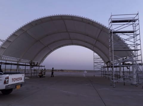 Arched membrane structure with scaffolding during installation